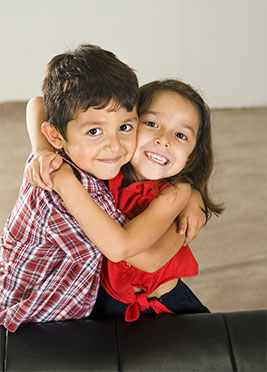 Brother and Sister Hugging at Pediatric Dentist Office in Clarks Summit
