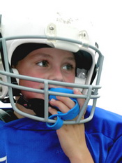 Child in Football Helmet With Mouthguard at Pediatric Dentist Office in Clarks Summit
