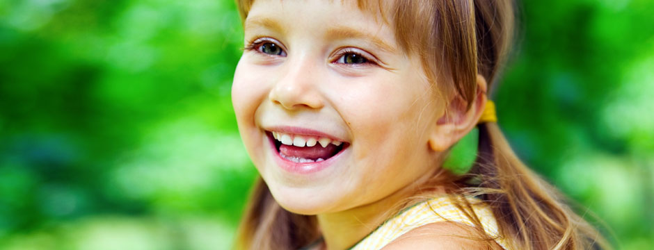 Little Girl in the Grass - Pediatric Dentists in Clarks Summit, PA